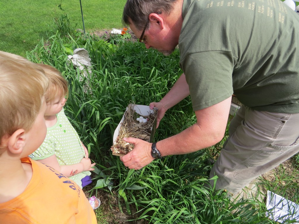 Randy showing Evan and Marin some Purple Martin eggs during a nest check